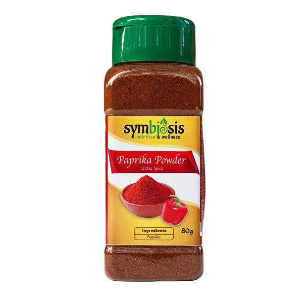 Bottle of Symbiosis Paprika Powder on a gray background
