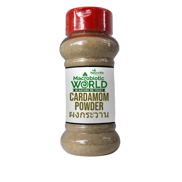 Bottle of cardamom powder with a red lid on a gray background
