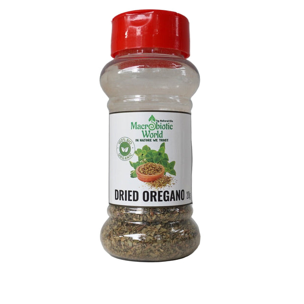 Bottle of dried oregano with a red lid on a gray background