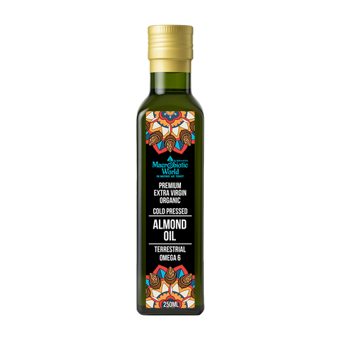 Bottle of almond oil with a colorful label on a white background