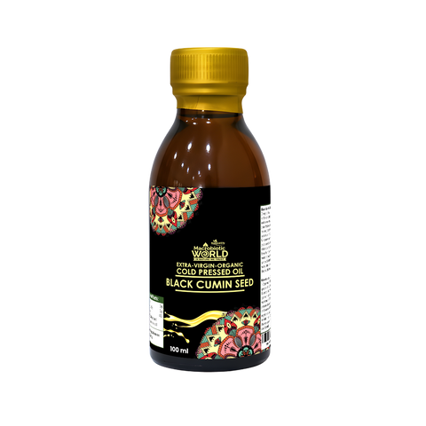 Bottle of black cumin seed oil with a colorful label on a white background