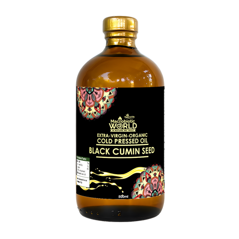 Bottle of black cumin seed oil with a colorful label on a white background
