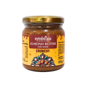 Jar of Symbiosis Almond Butter Crunchy on a white background
