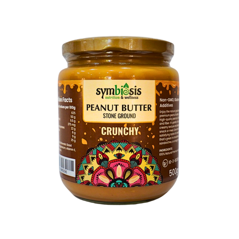 Jar of Symbiosis peanut butter with decorative label on a white background
