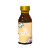 Bottle of hazelnut oil with a yellow cap on a white background