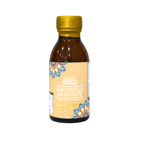 Bottle of hazelnut oil with a yellow cap on a white background