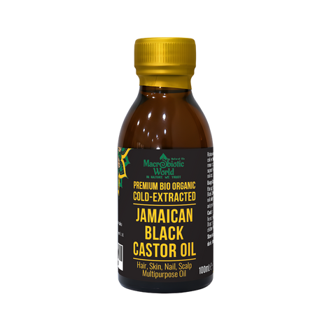 Bottle of Jamaican Black Castor Oil with a gold cap on a white background