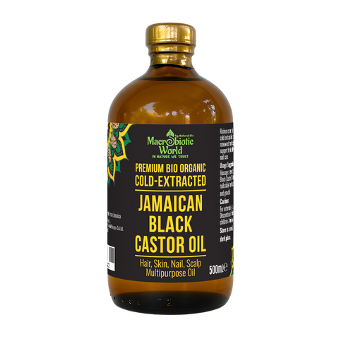 Bottle of Jamaican Black Castor Oil with a gold cap on a white background