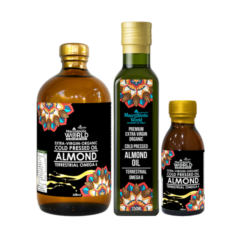 Three bottles of Macrotropic World almond oil with colorful labels on a white background