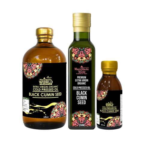 Three bottles of Macchie World Black Cumin Seed oil on a white background