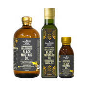 Three bottles of Black Mustard Oil from Macrobiotic World on a white background