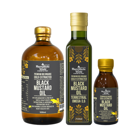 Three bottles of Black Mustard Oil from Macrobiotic World on a white background