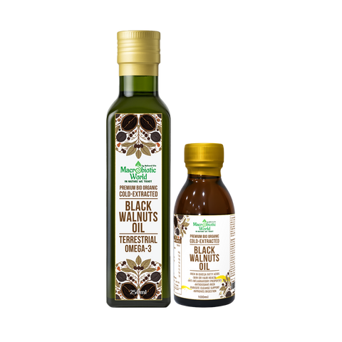 Two bottles of Black Walnuts Oil from Macrobiotic World on a white background