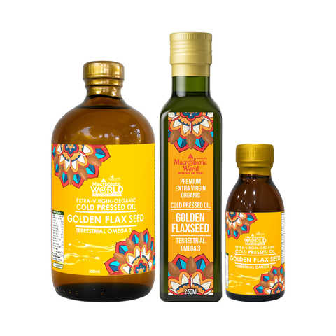 Three bottles of Golden Flaxseed oil with colorful labels on a white background