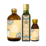 Three bottles of hazelnut oil with colorful labels on a white background