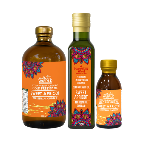 Three bottles of Sweet Apricot oil from Macrobiotic World on a white background