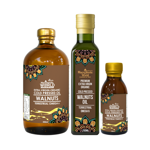 Three bottles of Macchie World walnut oil on a white background