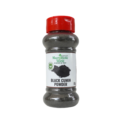 Bottle of black cumin powder with a red lid on a white background