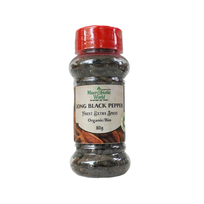 Bottle of long black pepper with a red lid on a white background