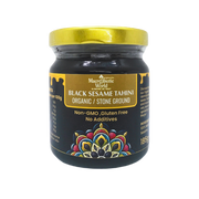 Jar of Black Sesame Tahini with a gold lid on a white background