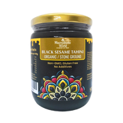 Jar of Black Sesame Tahini with decorative label on a white background