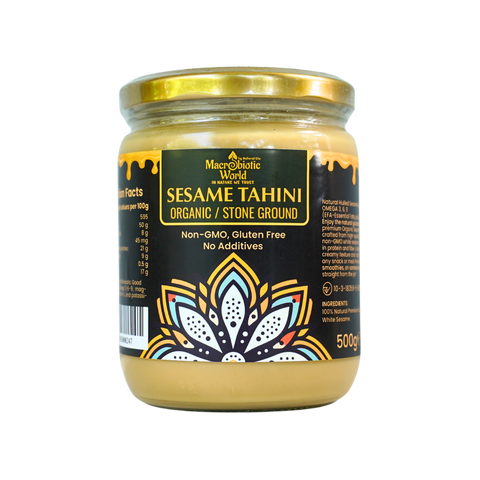 Jar of organic sesame tahini with a decorative label on a white background
