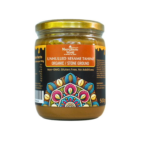 Jar of unhulled sesame tahini with colorful label on a white background