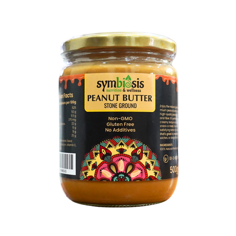Jar of Symbiosis peanut butter with decorative label on a white background