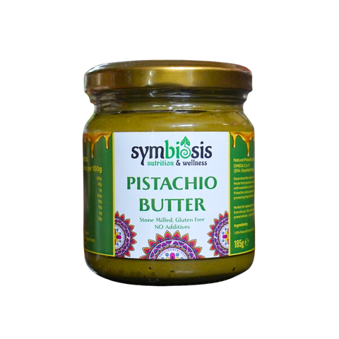 Jar of Symbiosis Pistachio Butter on a white background