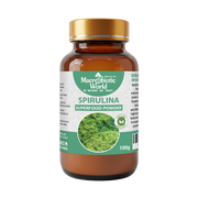 Spirulina superfood powder bottle with a gold cap on a white background