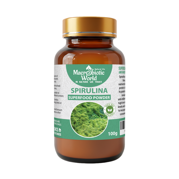 Spirulina superfood powder bottle with a gold cap on a white background