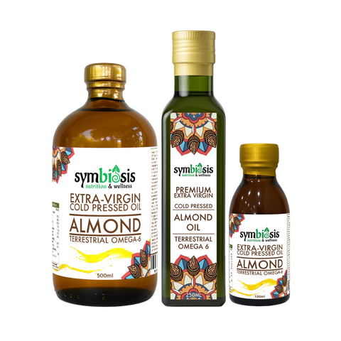 Three bottles of Symbiosis Almond Oil on a white background