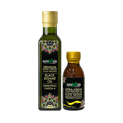 Two bottles of Symbiosis Black Sesame Oil on a white background