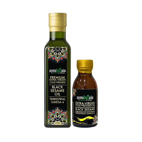 Two bottles of Symbiosis Black Sesame Oil on a white background
