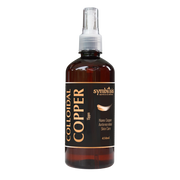 Bottle of colloidal copper solution with a spray nozzle on a white background