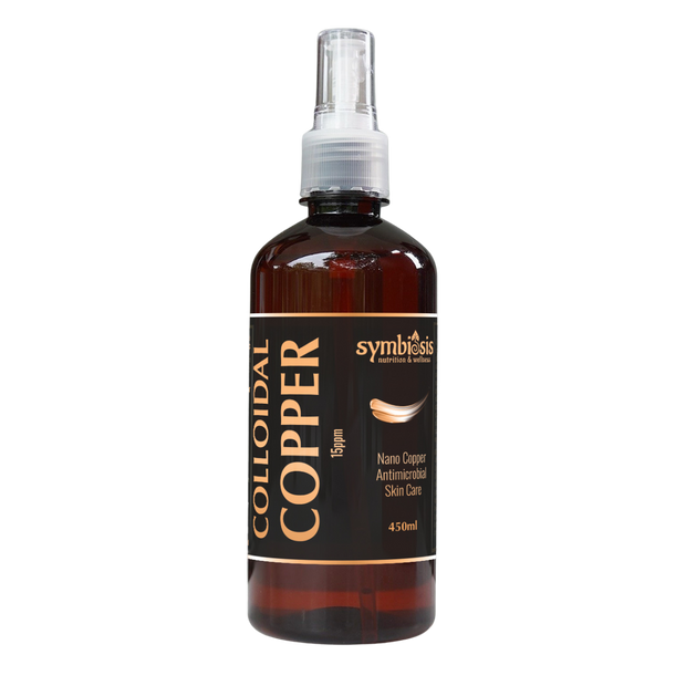 Bottle of colloidal copper solution with a spray nozzle on a white background