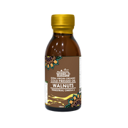 Bottle of walnut oil with a gold cap on a white background